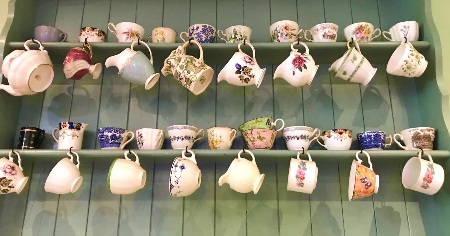 Vintage china adorns the walls at the pocket-size Lowry & Baker